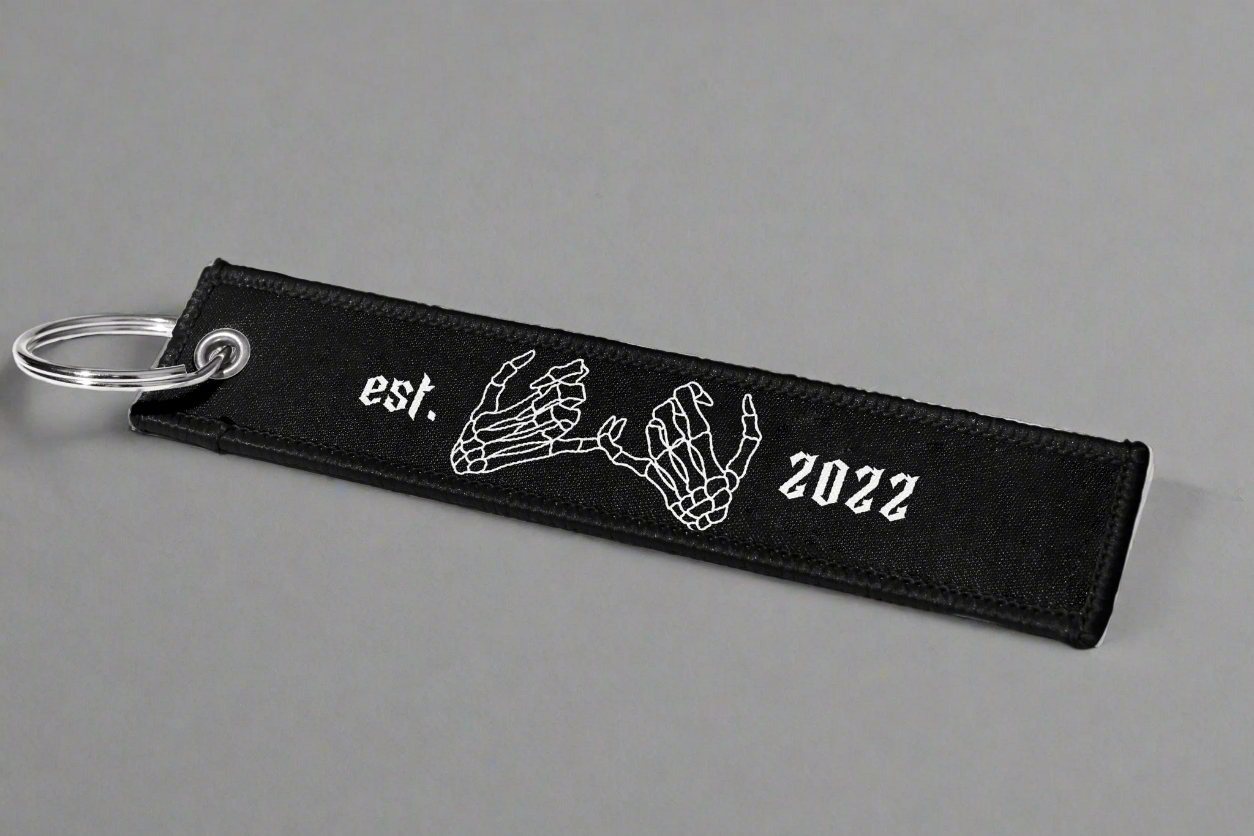 Jet tag back two skeleton hands linked together, along with 'EST. 2022' for an added touch of personalization and style.