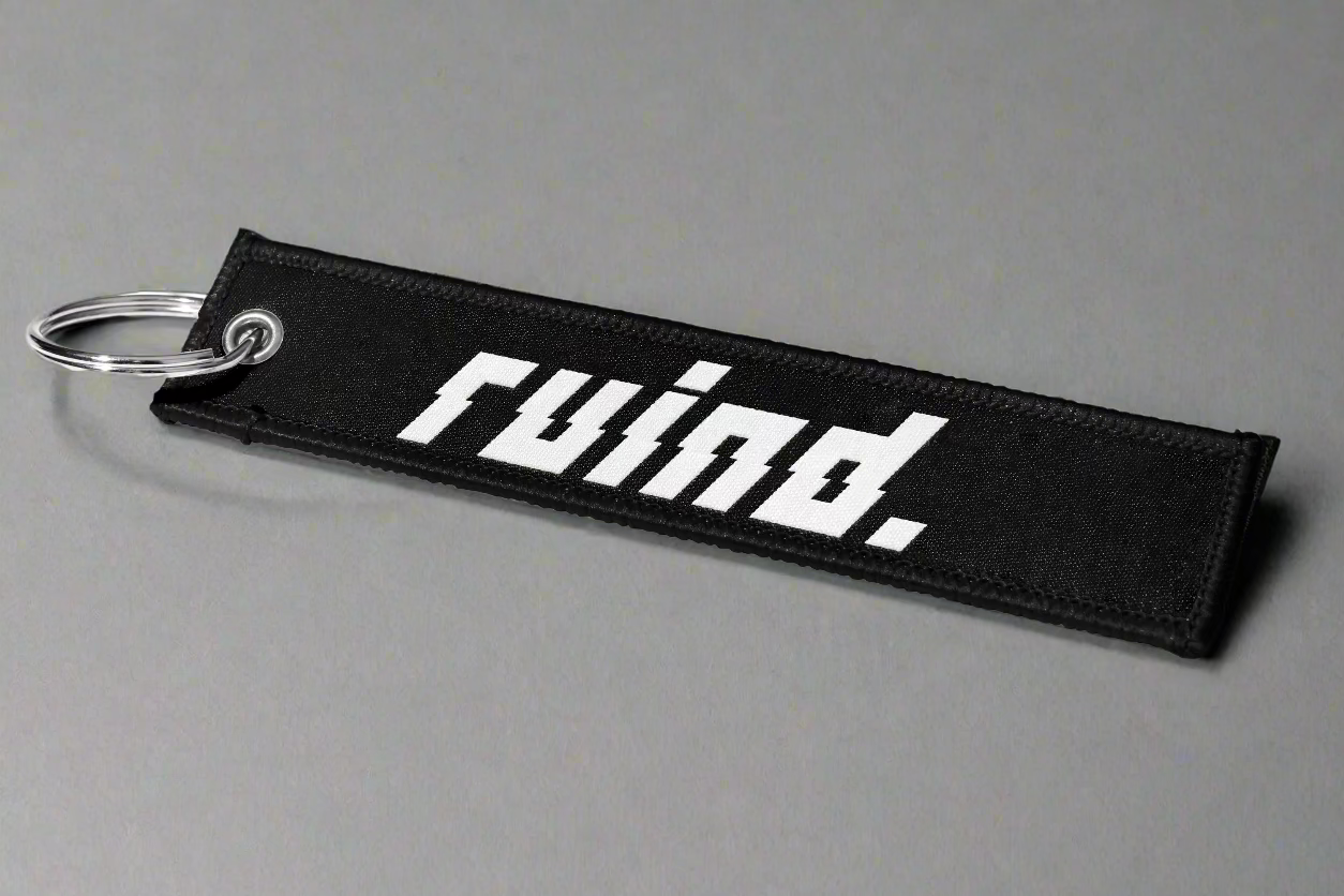 Jet tag featuring the bold 'Ruind' logo on the front, designed for a sleek and modern look.