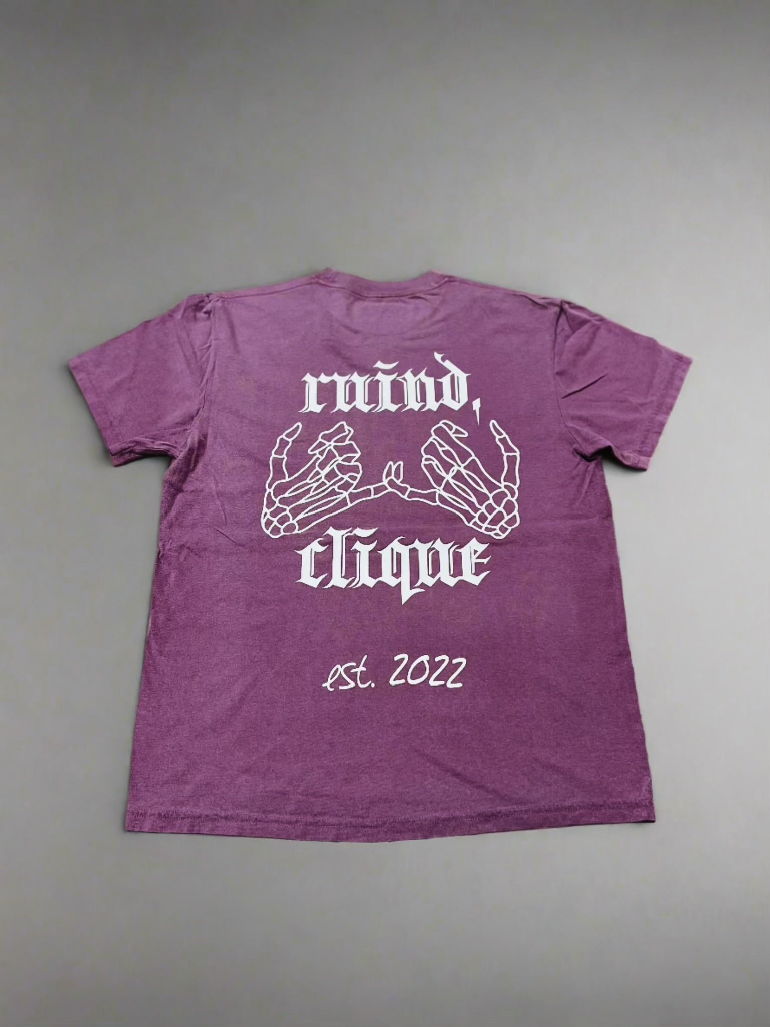 Berry t-shirt showcasing 'Ruind Clique' club name and two skeleton hands linked together, creating a striking back design.